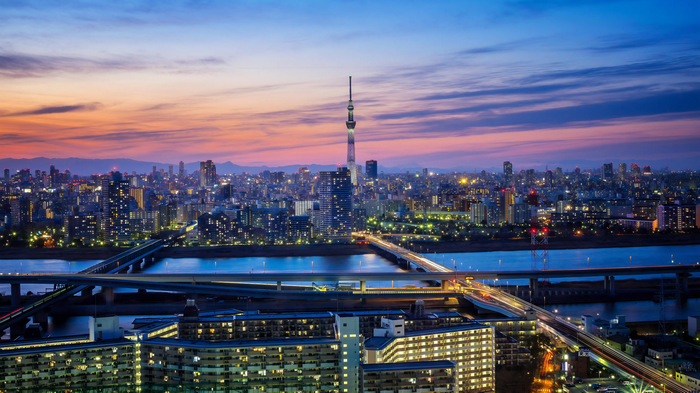4K Tokyo cityscape with Tokyo Skytree and bridges at dusk