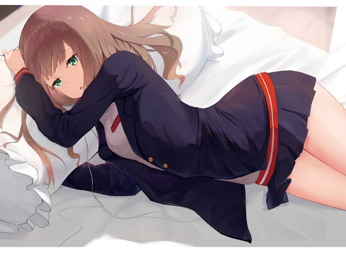 Minami Yume in a school uniform on a bed