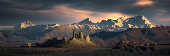 Panoramic view of snow-capped mountains and rock formations