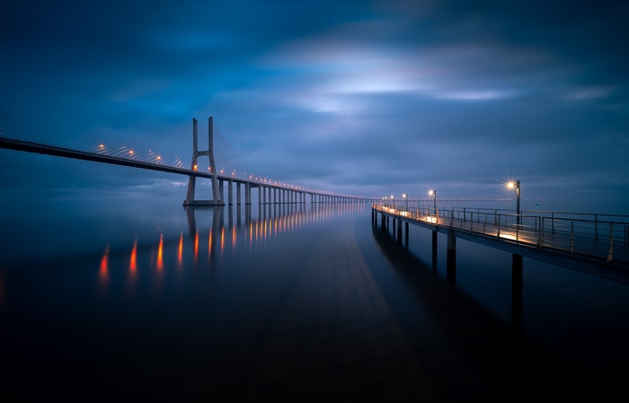 Vasco da Gama Bridge at night with reflections