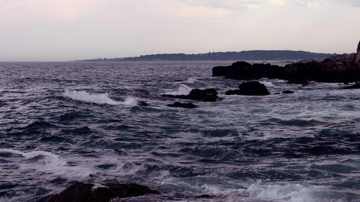 4K Coast with Dark Rocks and Waves
