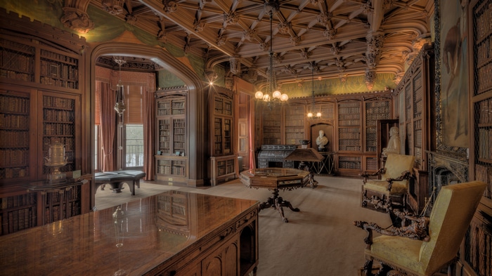 4K library interior with ornate wooden bookshelves