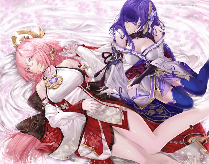 Two women with pink and purple hair lying down