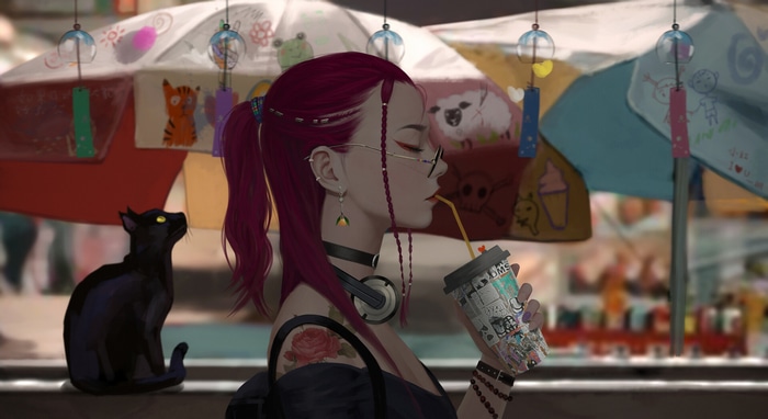 Woman with headphones and black cat drinking from a cup
