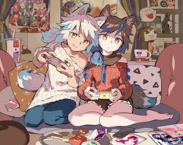 Two anime girls playing video games on a couch