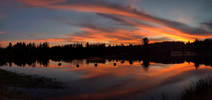 Sunset over Mud Bay Olympia with orange sky reflection