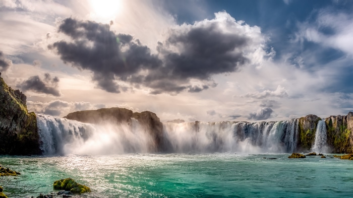 4K Iceland Waterfall Landscape with Sun and Clouds