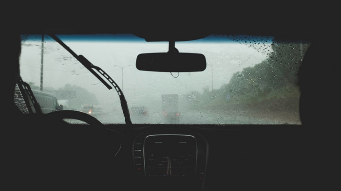 POV looking out car window in rain