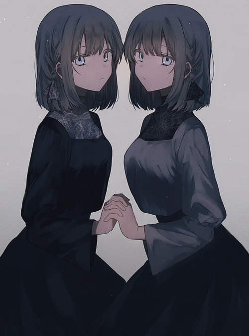 Two girls in dark dresses holding hands