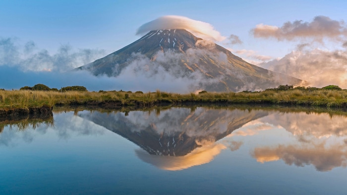 Mount Taranaki reflection in water with clouds