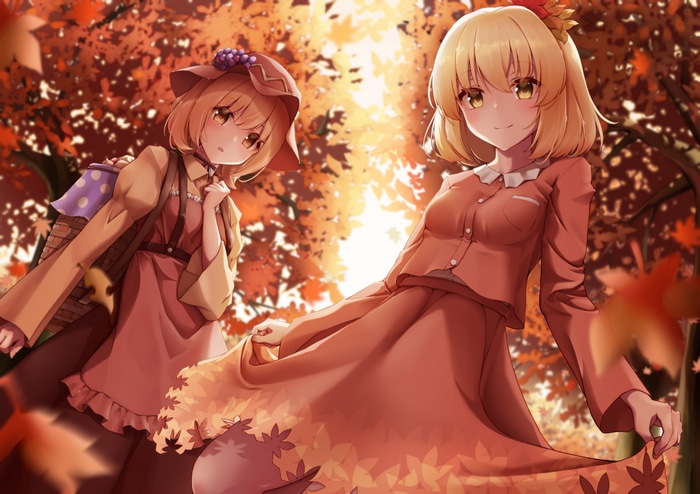 Two women in fall forest