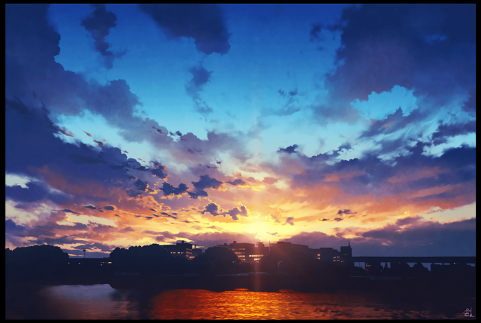 Sunset over a city skyline with dramatic clouds
