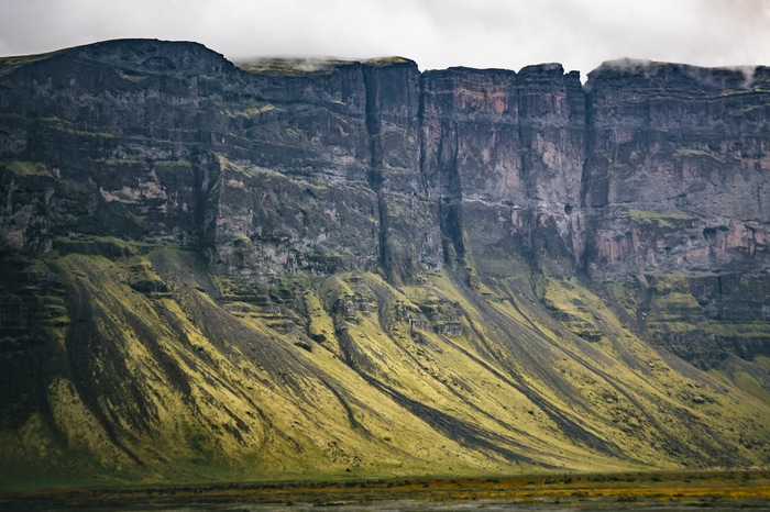 4K Iceland Landscape of Rocky Cliffs and Green Slopes