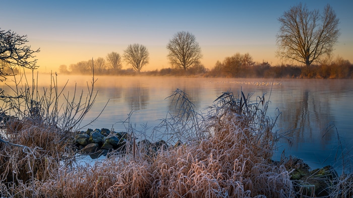4K Winter Landscape with Foggy River at Sunrise