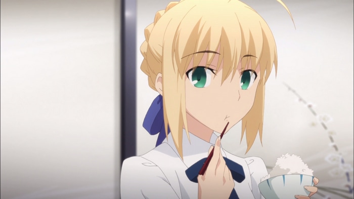 Artoria Pendragon eating rice from a bowl
