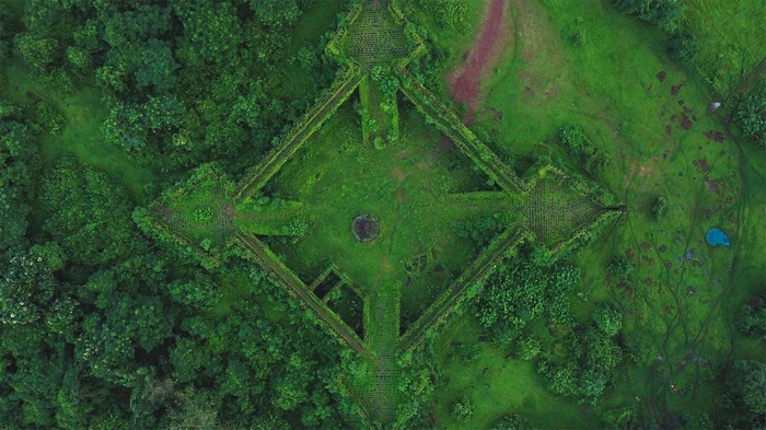 Aerial view of a diamond-shaped fort surrounded by greenery