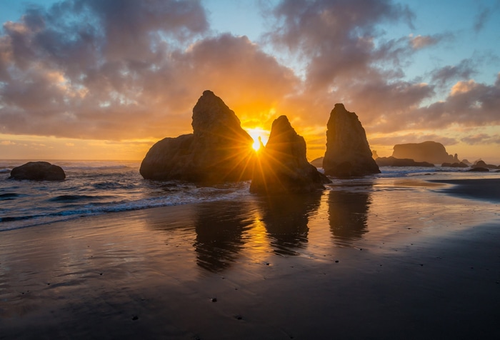 Sunset over sea stacks on a beach