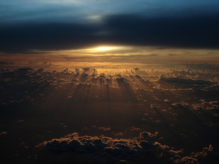 Sunset with crepuscular rays over clouds