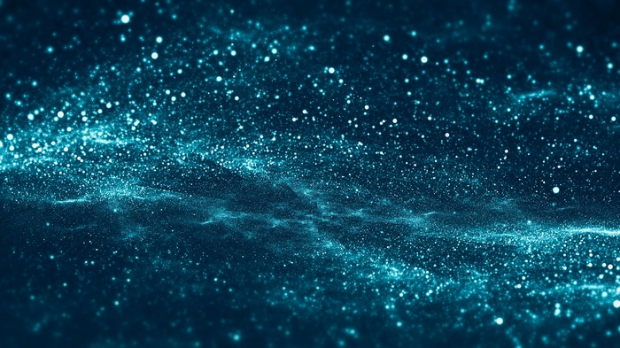 Abstract blue and turquoise particles in dark space