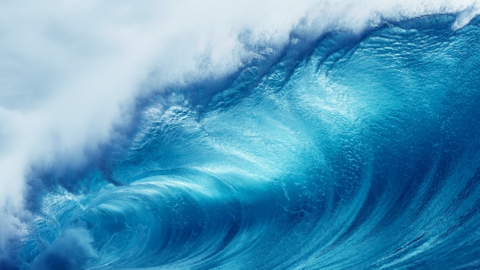 Close-up of a powerful blue ocean wave