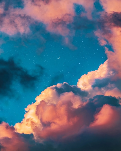 Crescent Moon and Stars in a Cloudy Sky