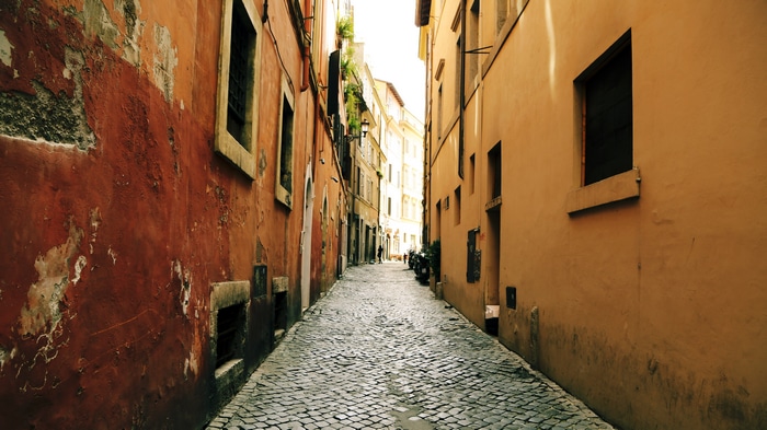 Alleyway in Europe with Red and Yellow Walls