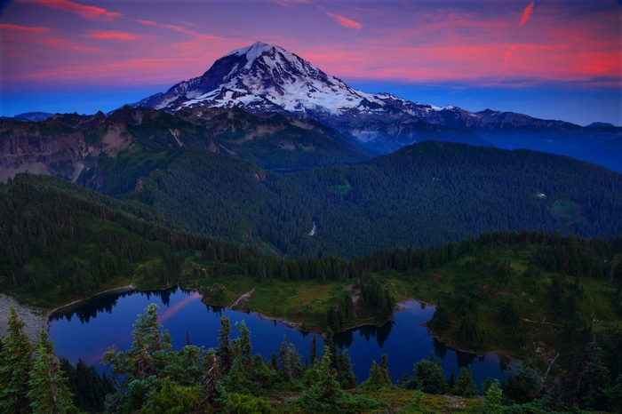 Mount Rainier reflected in a lake at sunset