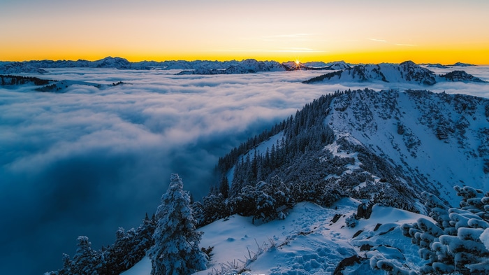 4K Snowy Mountain Landscape with Sunrise Over Clouds