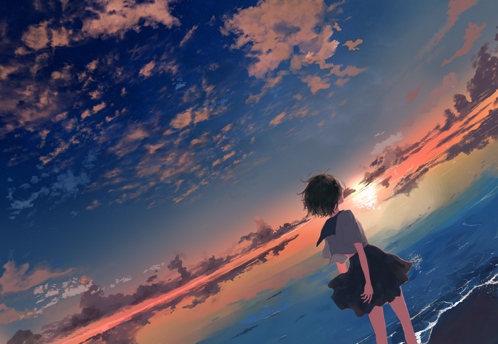 Girl in school uniform on beach at sunset
