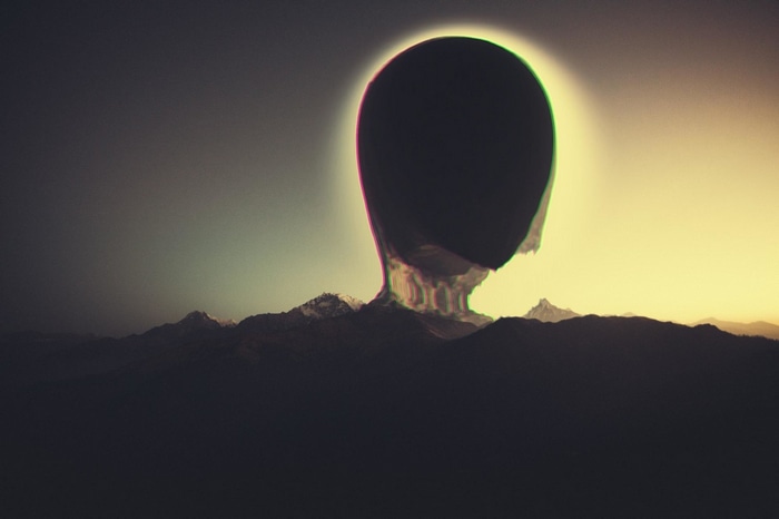 Glitch art of a dark silhouette against the sun