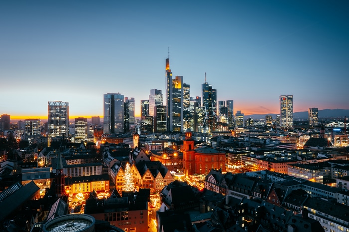 Frankfurt skyline at dusk with Christmas market