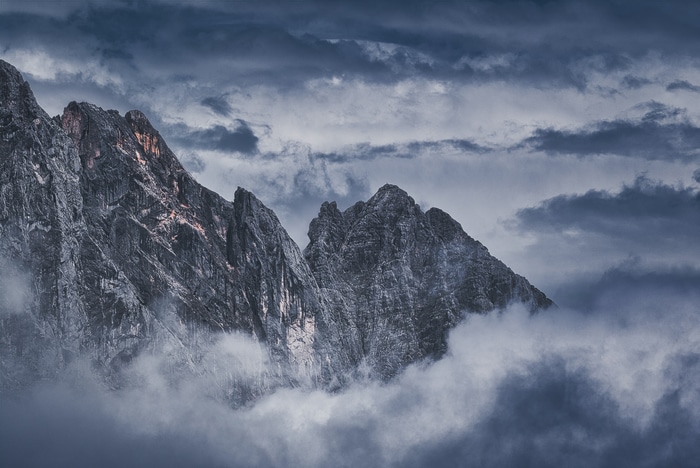 Dramatic mountain peaks shrouded in clouds