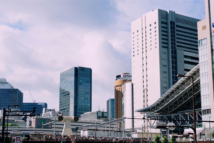 Osaka cityscape with modern buildings and train station