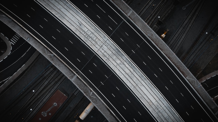 Aerial view of a highway overpass and railway tracks