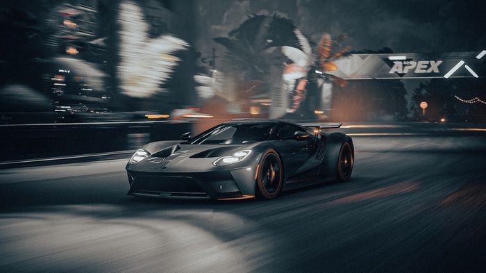 Ford GT Mk II racing at night with Apex banner