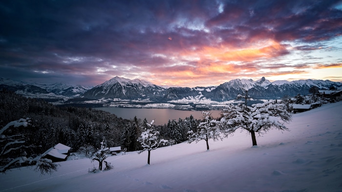 4K Snowy Mountain Landscape with Lake at Sunset
