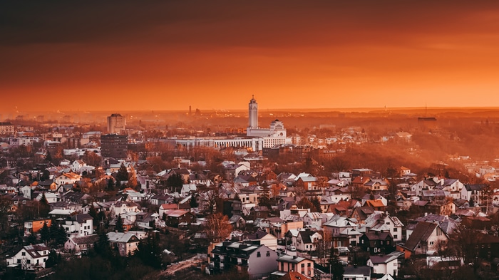 4K panorama of Kaunas cityscape with orange sky