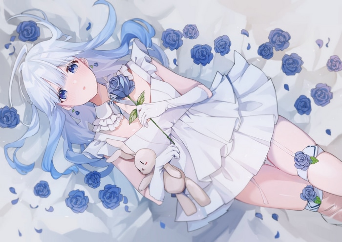 Emeralda with blue hair and blue eyes surrounded by blue roses