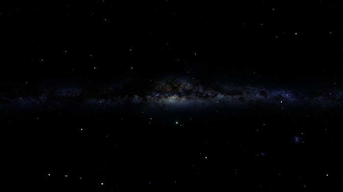 Milky Way galaxy with stars and a green planet