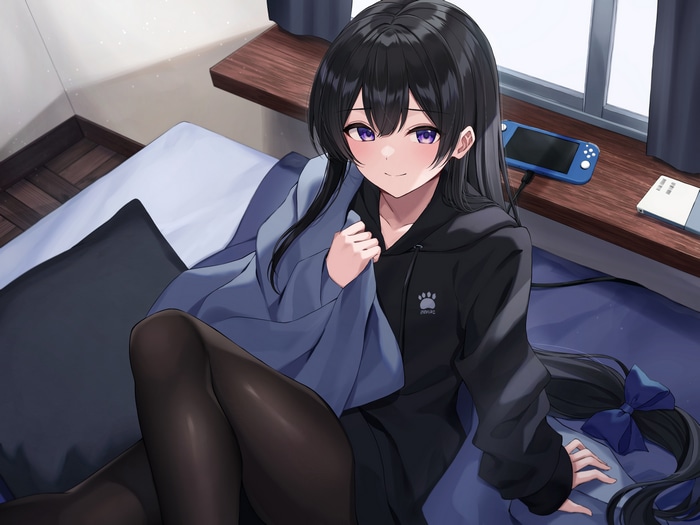 Kurousagi Yuu in bed with a Nintendo Switch