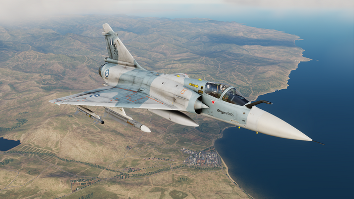 Mirage 2000 fighter jet flying over a coastline