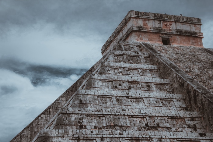 Chichen Itza Pyramid under a cloudy sky