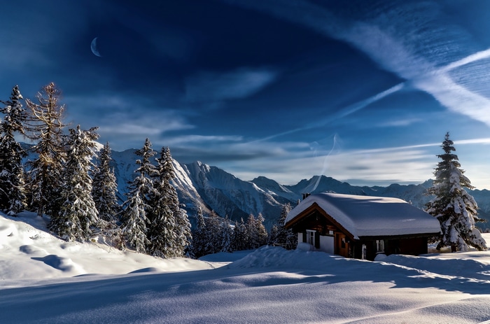 4K Winter Landscape with Snow-Covered House and Mountains