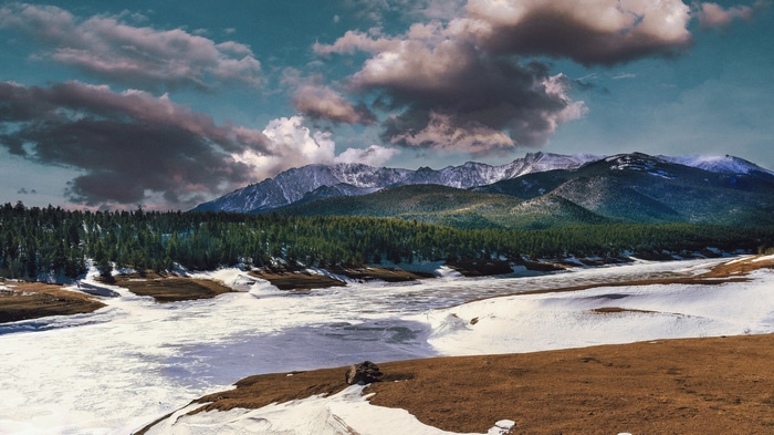 4K mountains with trees and snow