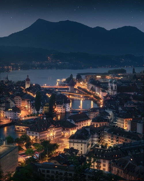 Luzern cityscape at night with mountains and lake