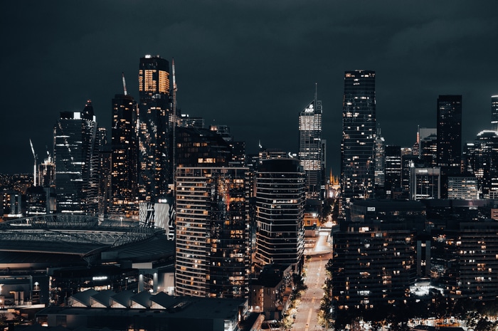 City skyline at night with illuminated skyscrapers