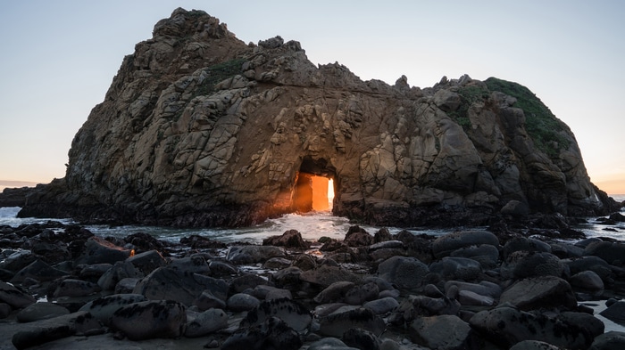 Sunset through Keyhole Arch at Pfeiffer Beach, Big Sur