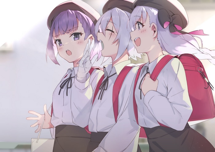 Three girls in school uniforms with backpacks