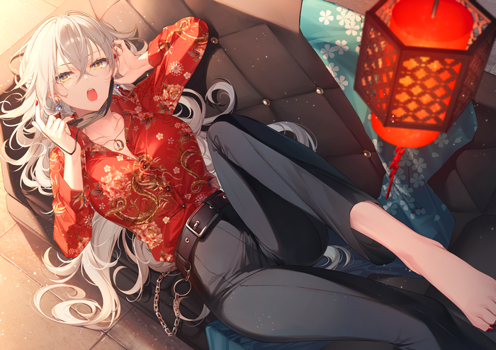 Silver-haired woman in red floral shirt lying on couch