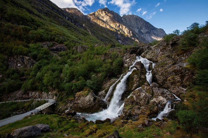 Waterfall cascading down rocky mountains in Norway